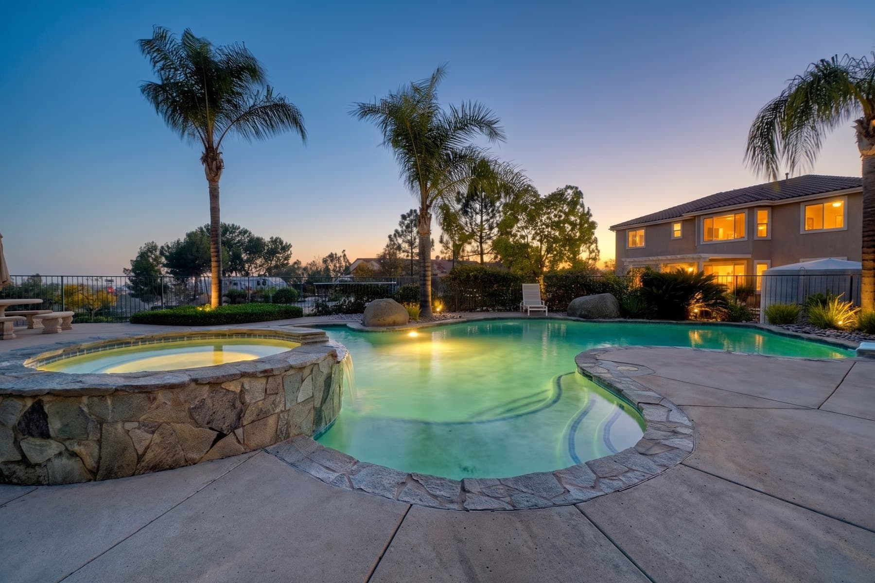 Alpine backyard pool and spa converted from a daytime photo to a virtual twilight image — Virtual twilight