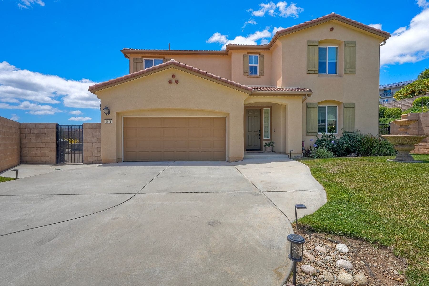 Simulated mistake: front exterior in clear, even sunlight under a blue sky